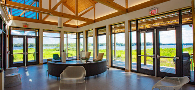 window walls and yellow pine glulam beams in the corner large room