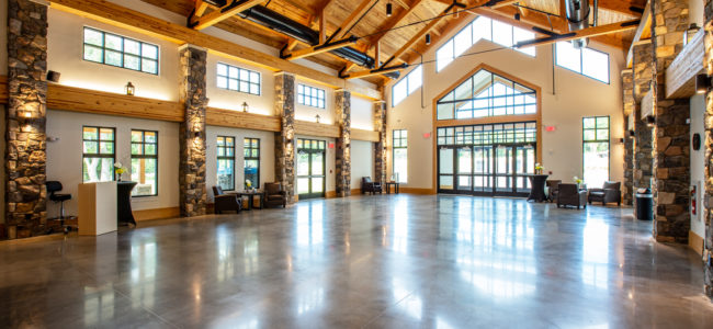 timber frame truss ceiling in sanctuary of church with polished floor