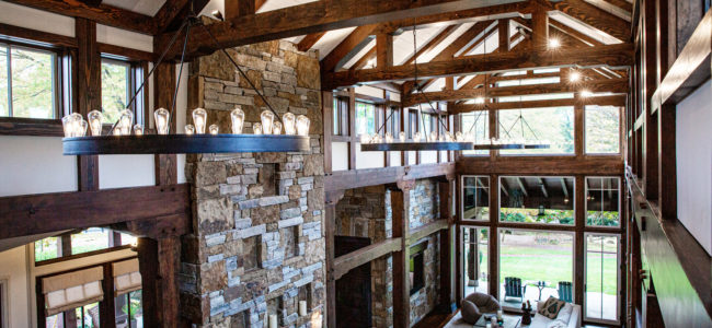 timber frame trusses featured in beautiful high ceiling living space in villanova pa home